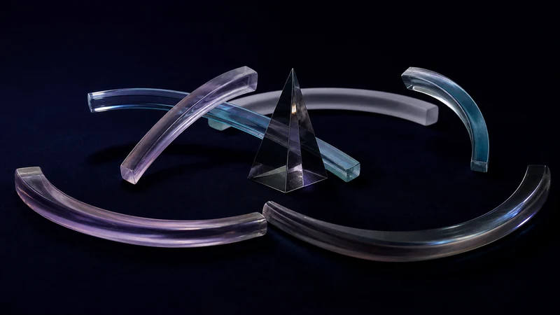 Dark blown-glass cover with several distinct interaction paths surrounding one central prism, representing relationship patterns in a single BaZi chart.